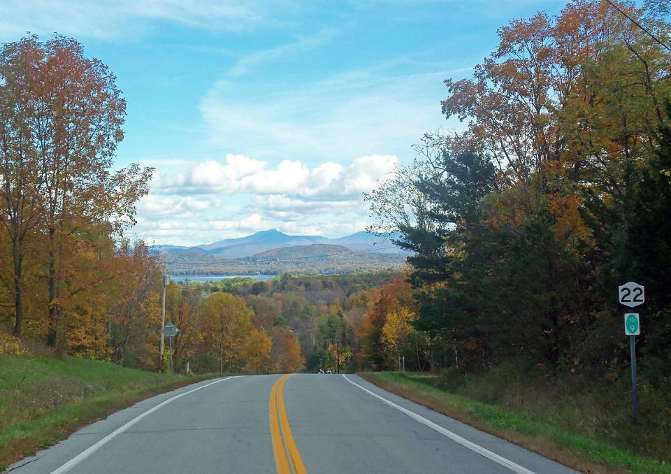 Essex VT road with view of Lake Champlain and Camel's Hump in the background