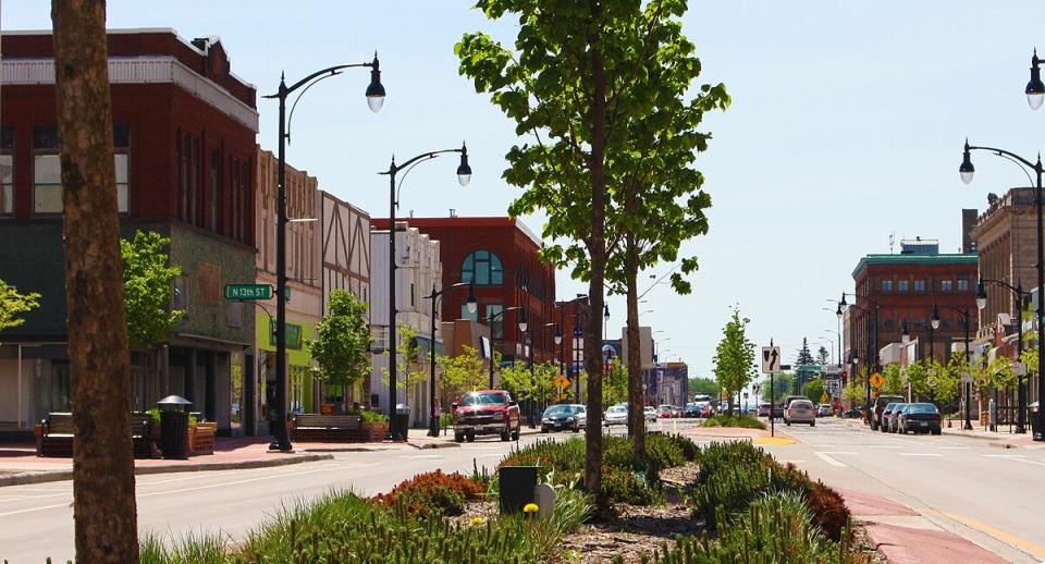 Downtown Superior Wisconsin during the daytime. The street in line with one and two story buildings