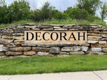 A stone wall with "Decorah" engraved on it